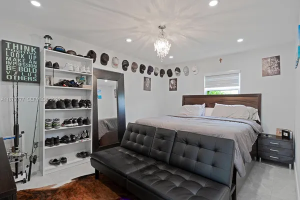 a bathroom with a toilet sink vanity granite and shower