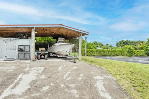 a view of a garden with a building in the background