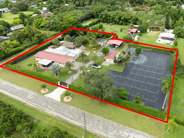an aerial view of a house with a swimming pool