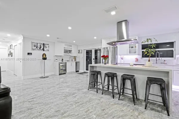 a kitchen with stainless steel appliances granite countertop a sink and cabinets