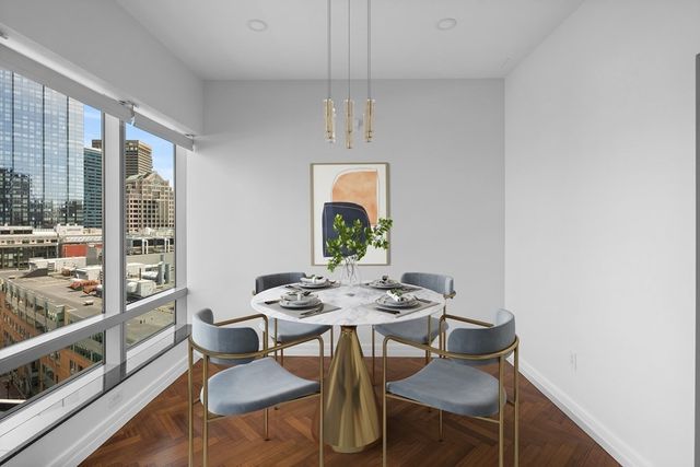 a dining room with furniture and window