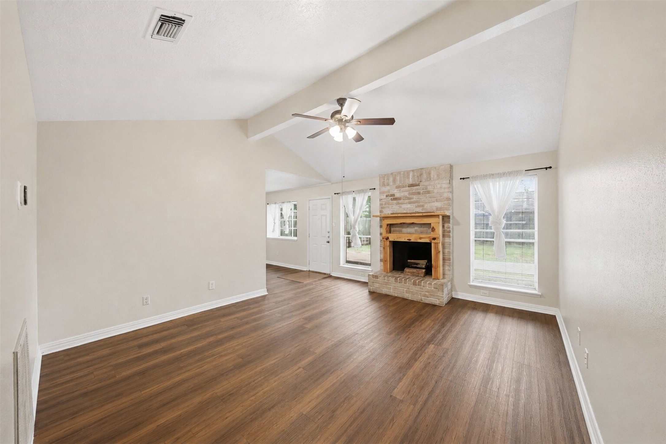 4818 Quailgate Drive Spring, TX 77373 - Photo 21 of 26 wooden floor fireplace and windows in an empty room
