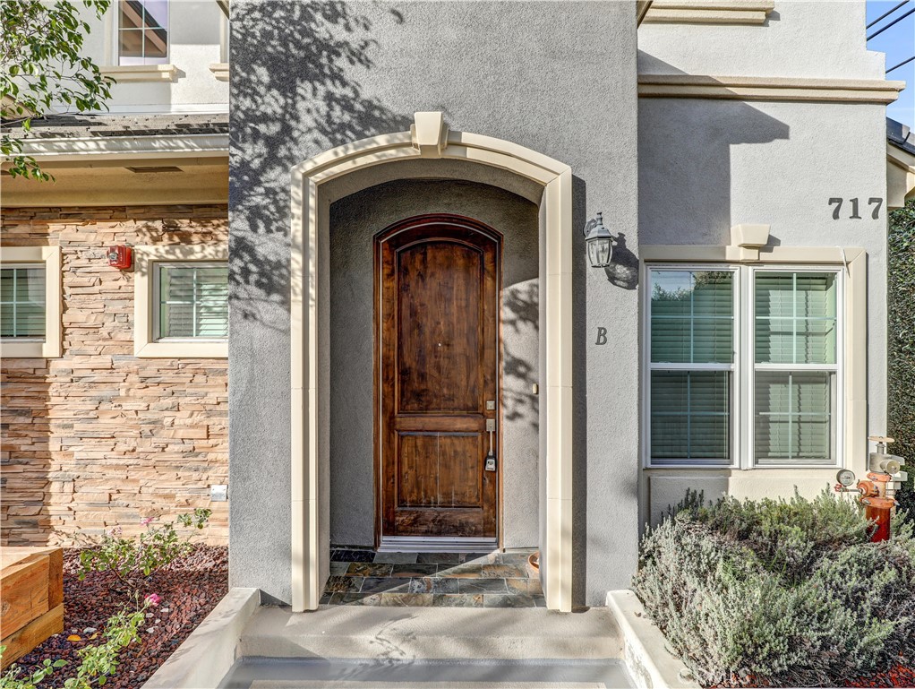 723 South Stoneman Avenue Alhambra, CA 91801 - Photo 3 of 11 a front view of a house with a glass door