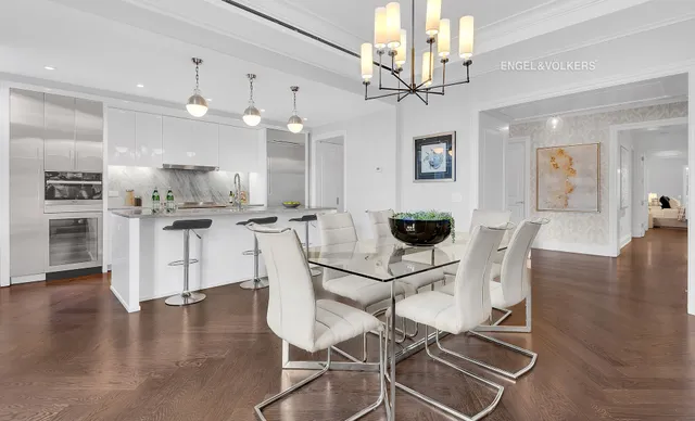 a kitchen with kitchen island granite countertop a sink cabinets and stainless steel appliances