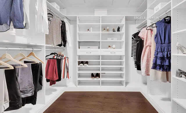 a room with a bed and a large window