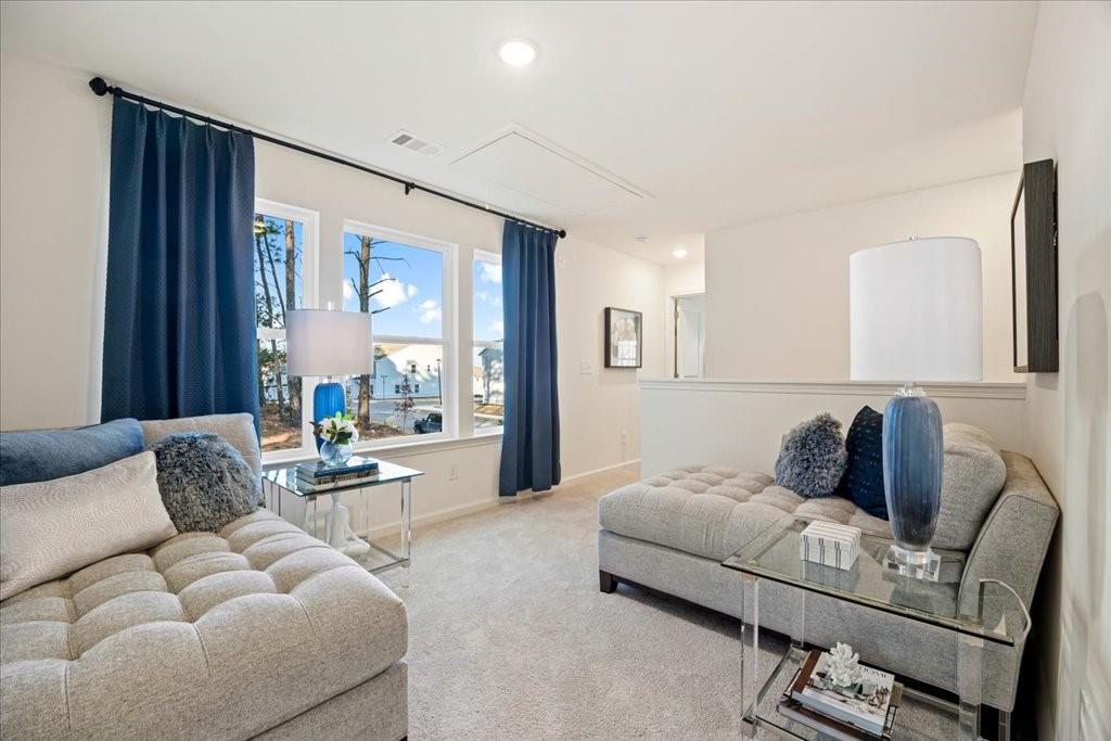 1833 Dawn Road, Unit 22 Conyers, GA 30013 - Photo 13 of 37 a bedroom with furniture and a large window