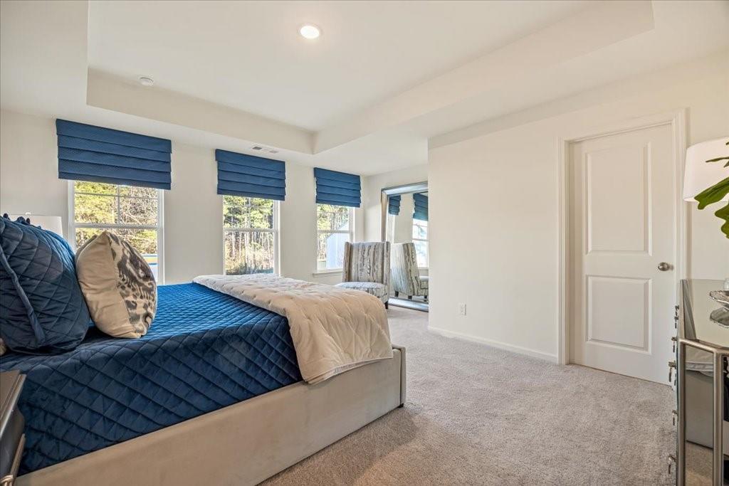 1833 Dawn Road, Unit 22 Conyers, GA 30013 - Photo 15 of 37 a bedroom with a bed and window