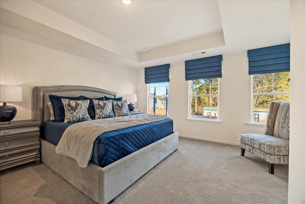 1833 Dawn Road, Unit 22 Conyers, GA 30013 - Photo 16 of 37 a bedroom with a bed and a couch