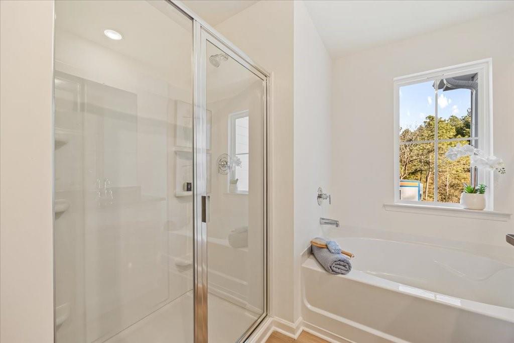 1833 Dawn Road, Unit 22 Conyers, GA 30013 - Photo 21 of 37 a bathroom with a bathtub and a shower