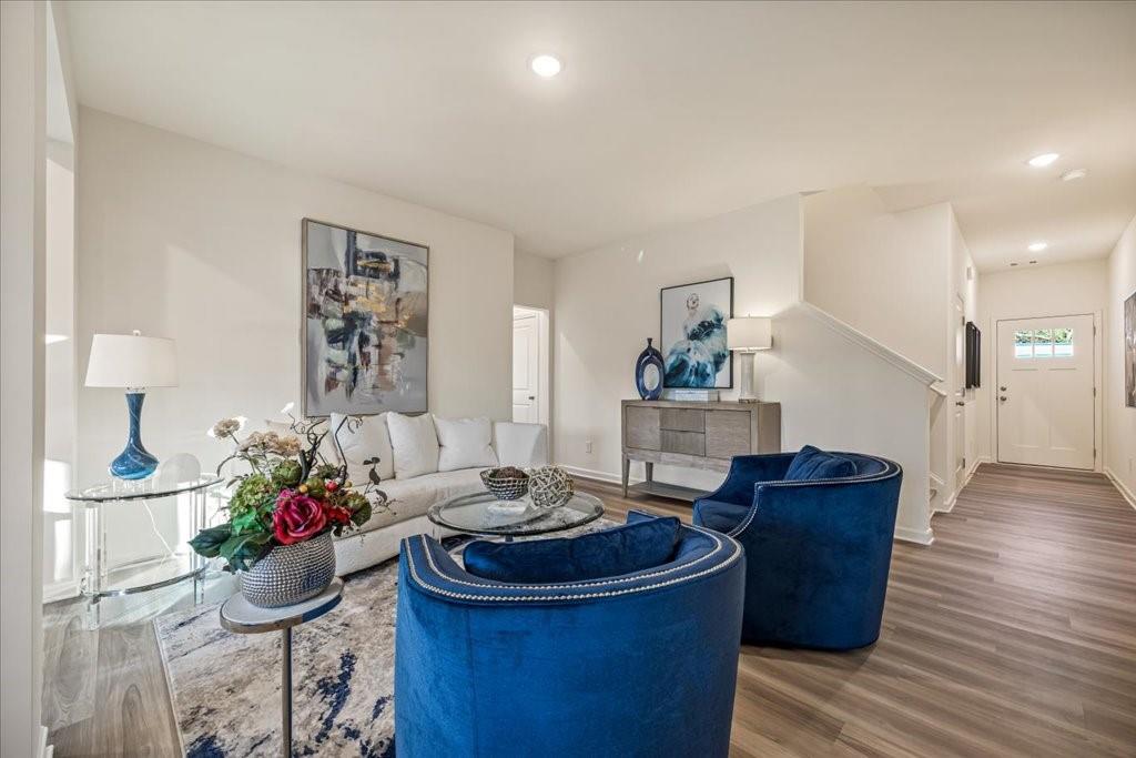 1833 Dawn Road, Unit 22 Conyers, GA 30013 - Photo 5 of 37 a living room with furniture and a potted plant