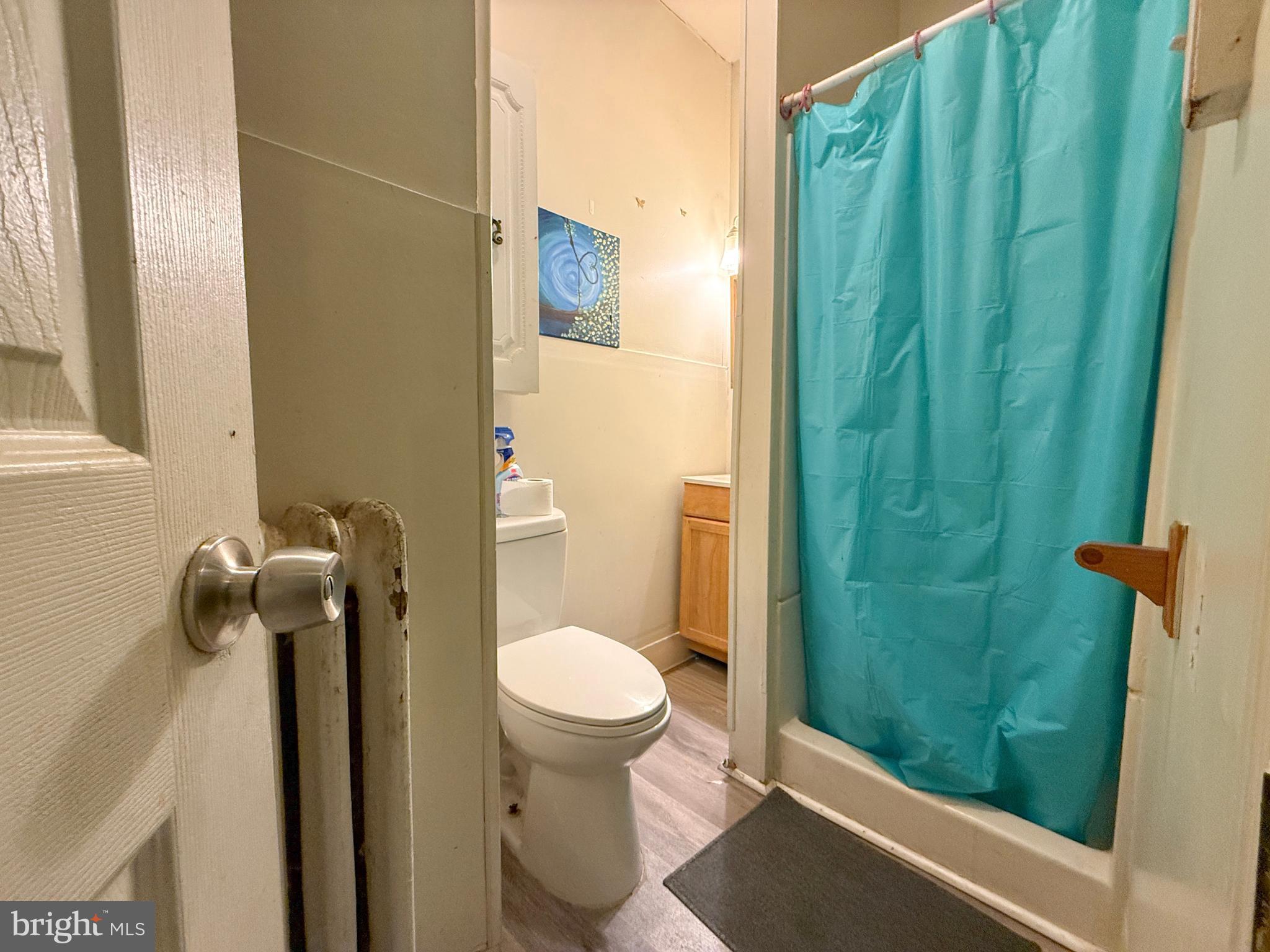 114 North 10th Street Reading, PA 19601 - Photo 11 of 43 a bathroom with a toilet and a shower
