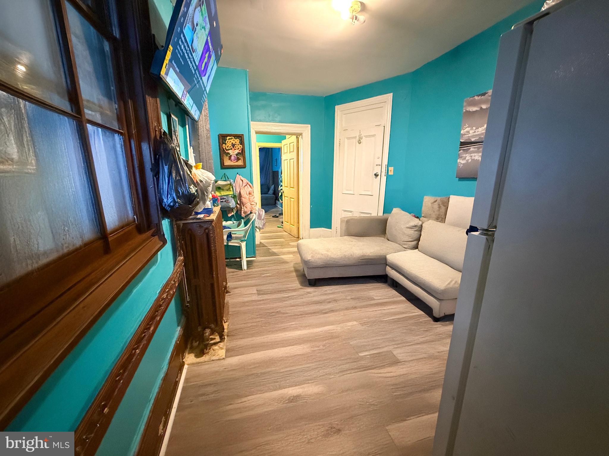 114 North 10th Street Reading, PA 19601 - Photo 14 of 43 a living room with furniture and a rug