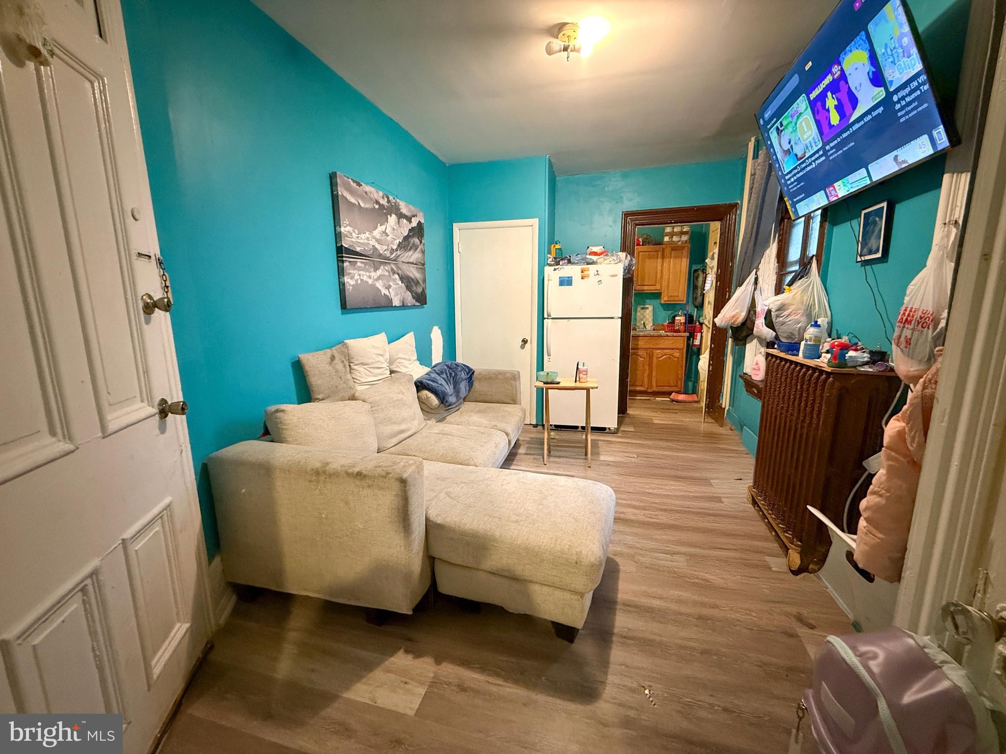 114 North 10th Street Reading, PA 19601 - Photo 15 of 43 a living room with furniture and a flat screen tv