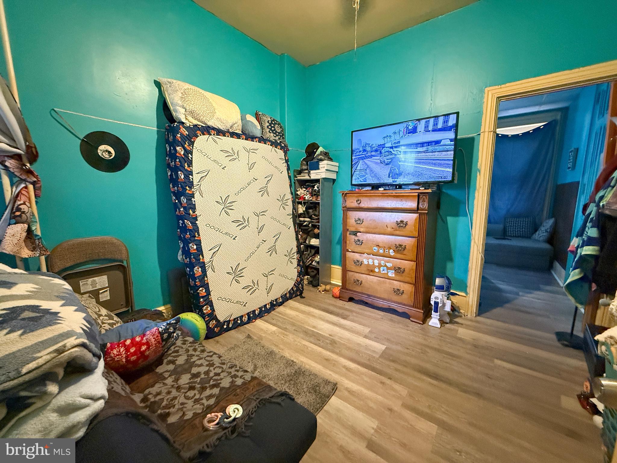 114 North 10th Street Reading, PA 19601 - Photo 16 of 43 a bedroom with a bed and a window