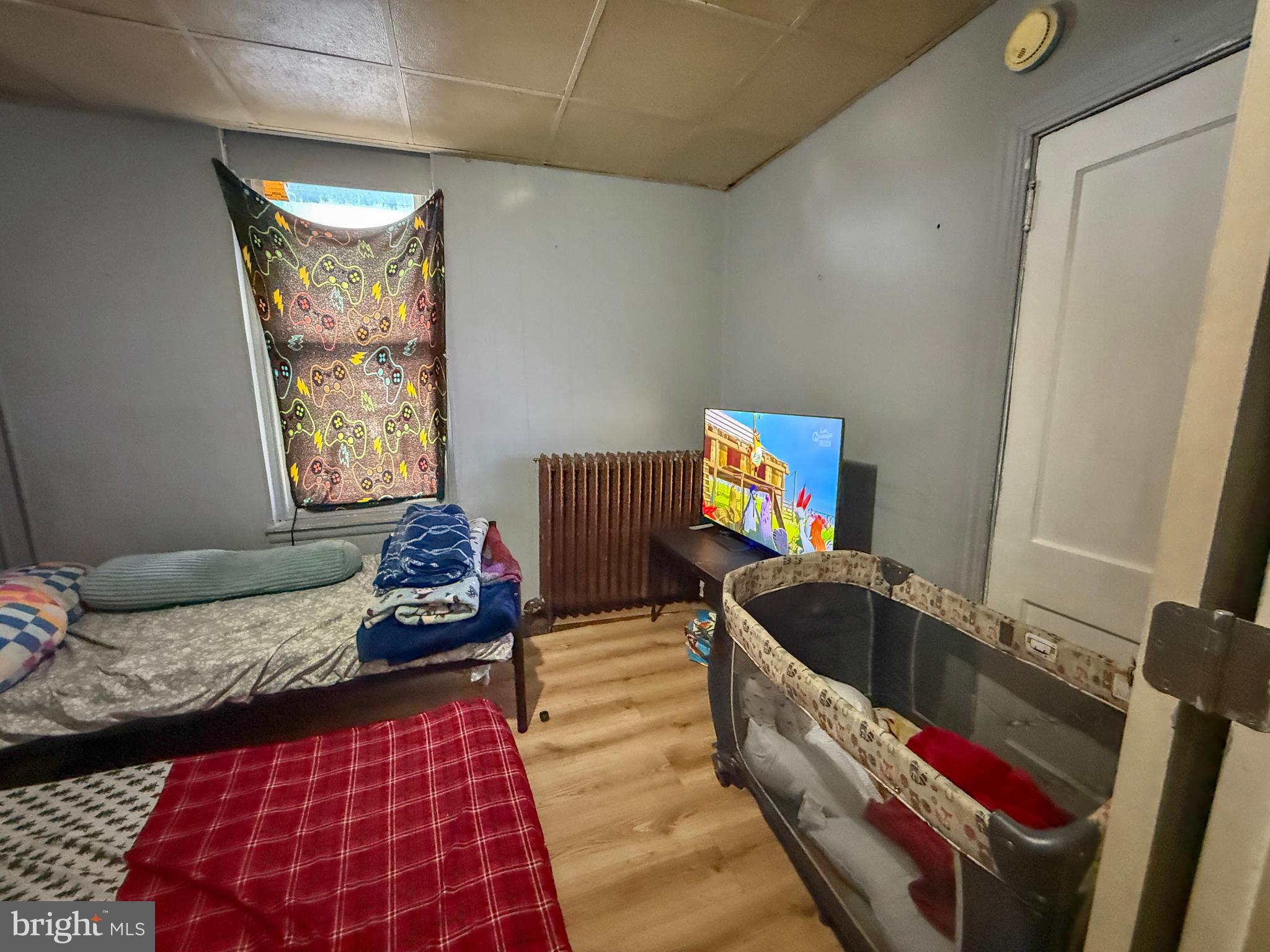 114 North 10th Street Reading, PA 19601 - Photo 33 of 43 a bedroom with furniture and a window