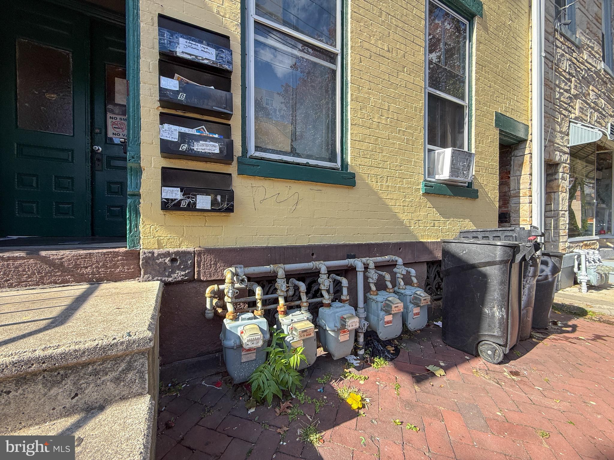 114 North 10th Street Reading, PA 19601 - Photo 42 of 43 a front view of a house with outdoor seating