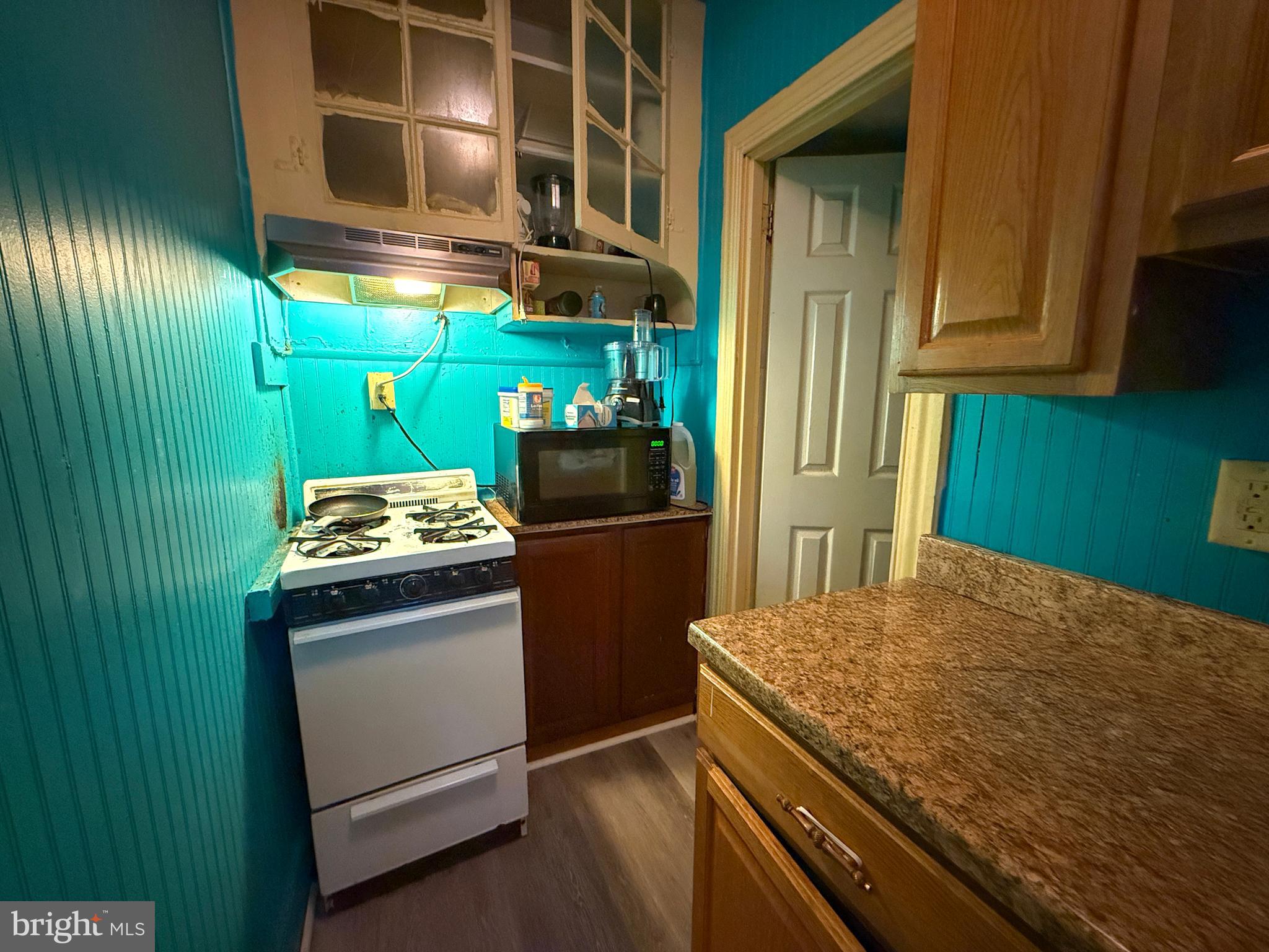 114 North 10th Street Reading, PA 19601 - Photo 9 of 43 a kitchen with stainless steel appliances granite countertop a refrigerator and a stove