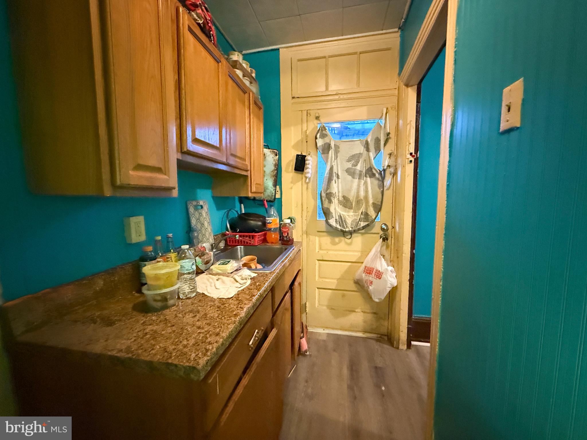 114 North 10th Street Reading, PA 19601 - Photo 10 of 43 a kitchen with a sink and cabinets