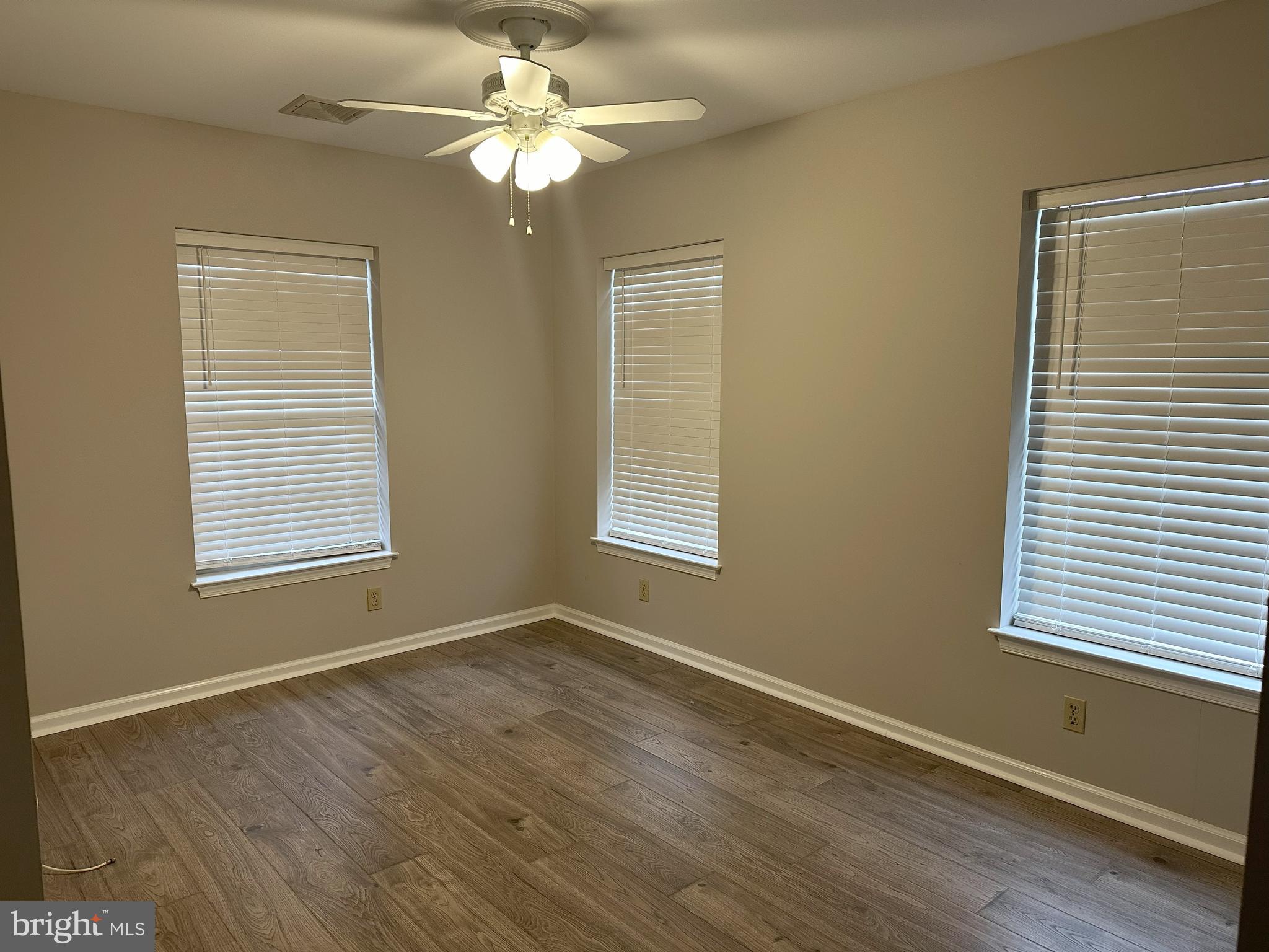 132 Delancy Place Lancaster, PA 17601 - Photo 4 of 14 a view of an empty room with a window and wooden floor