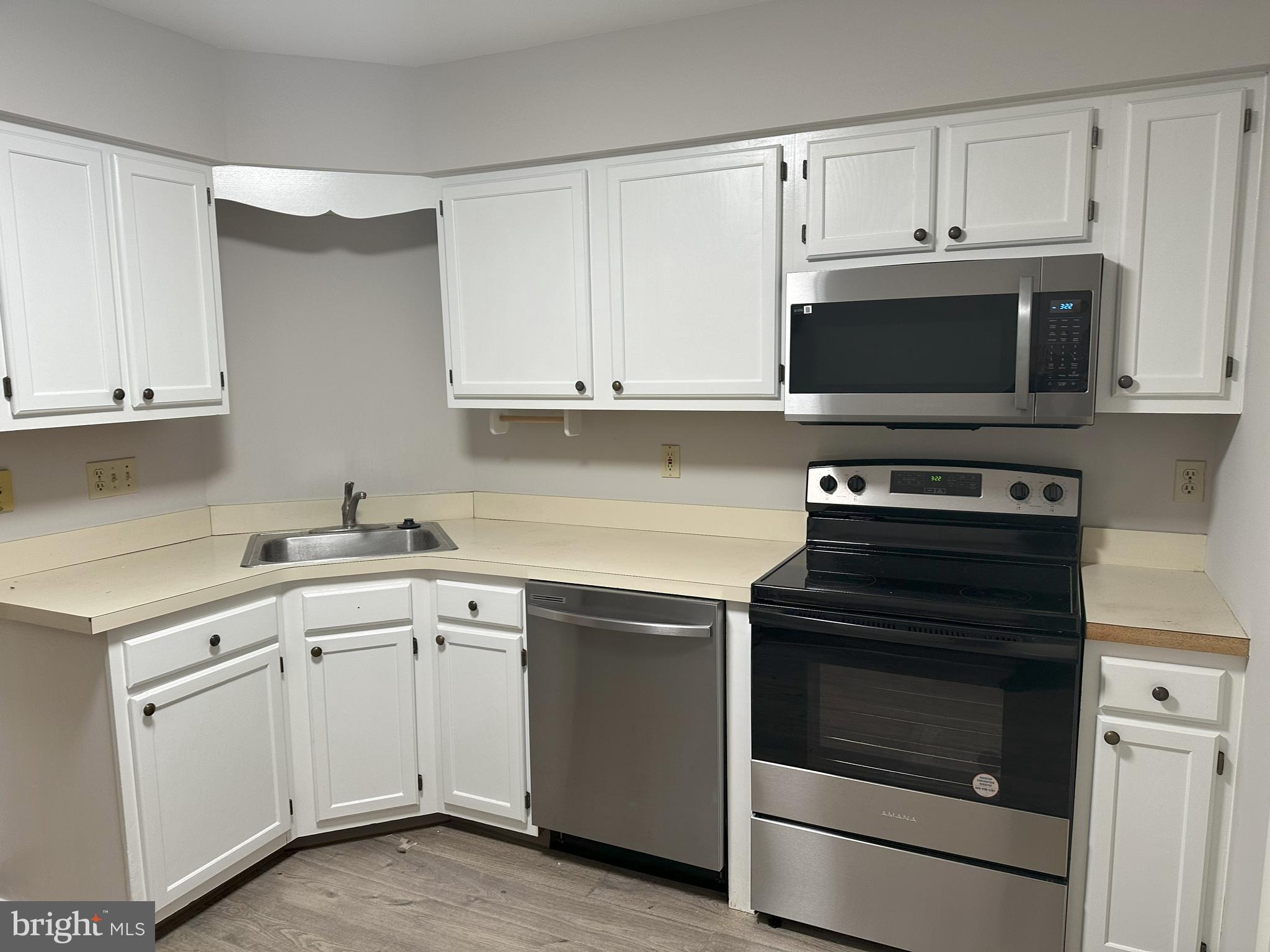 132 Delancy Place Lancaster, PA 17601 - Photo 5 of 14 a kitchen with cabinets appliances and a sink