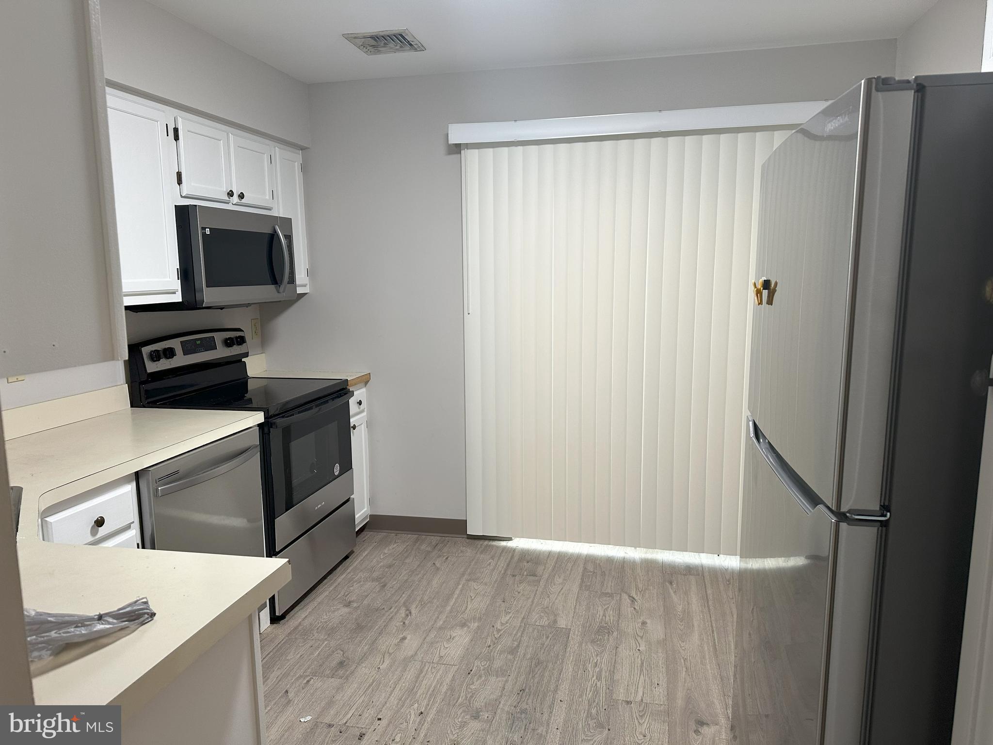 132 Delancy Place Lancaster, PA 17601 - Photo 6 of 14 a kitchen with a refrigerator stove and microwave