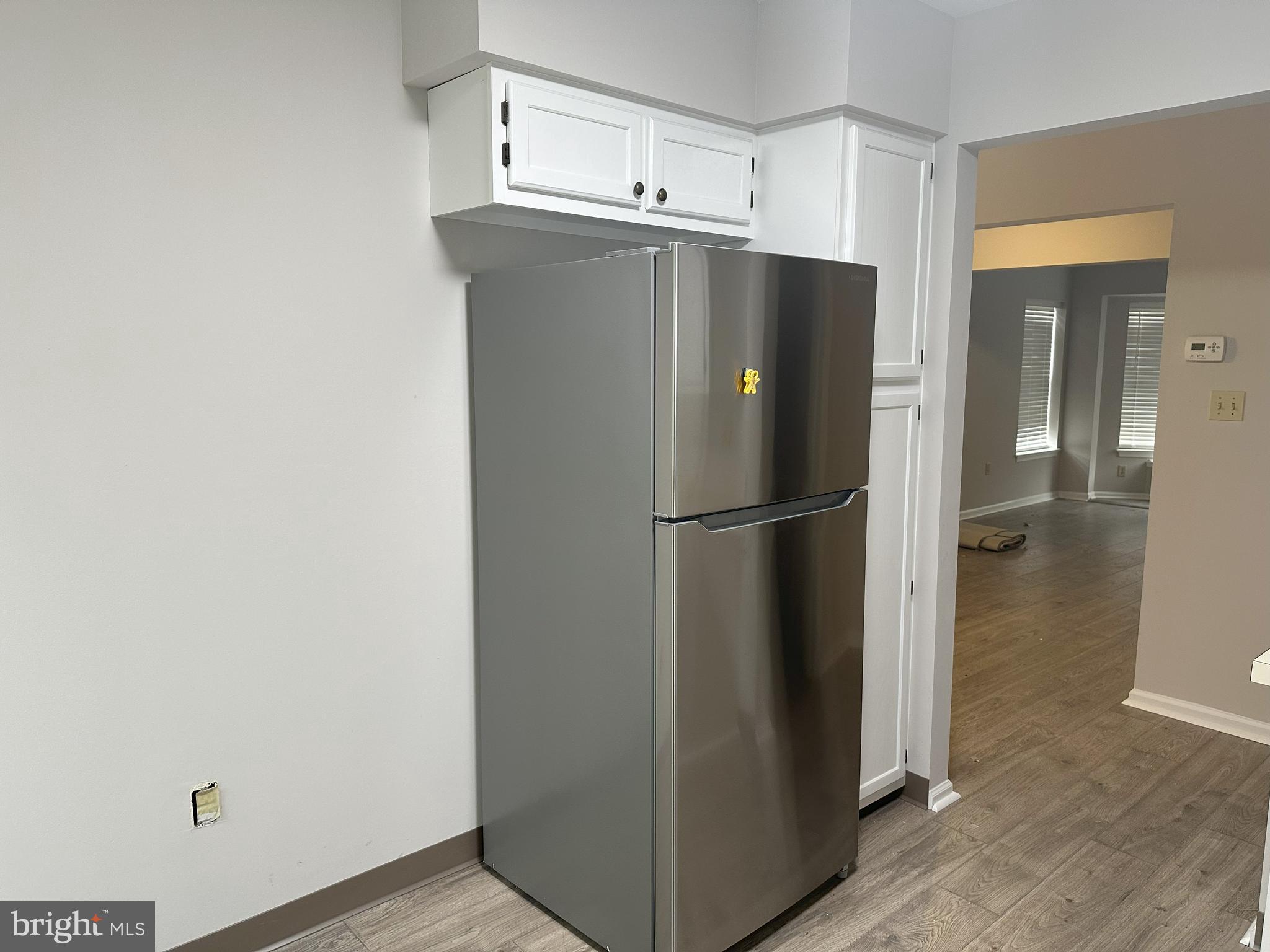 132 Delancy Place Lancaster, PA 17601 - Photo 7 of 14 a view of a kitchen with a refrigerator and wooden floor