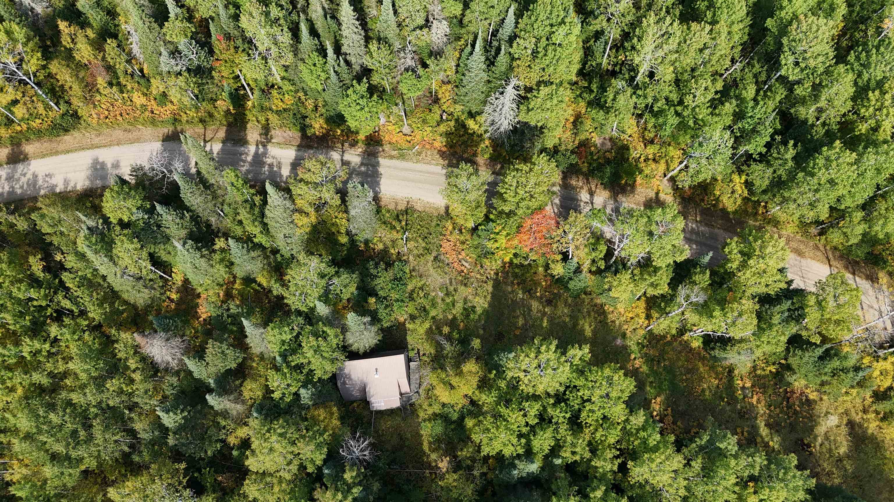 12012 Keyes Road Orr, MN 55771 - Photo 10 of 22 Aerial view of property's location with a heavily wooded area