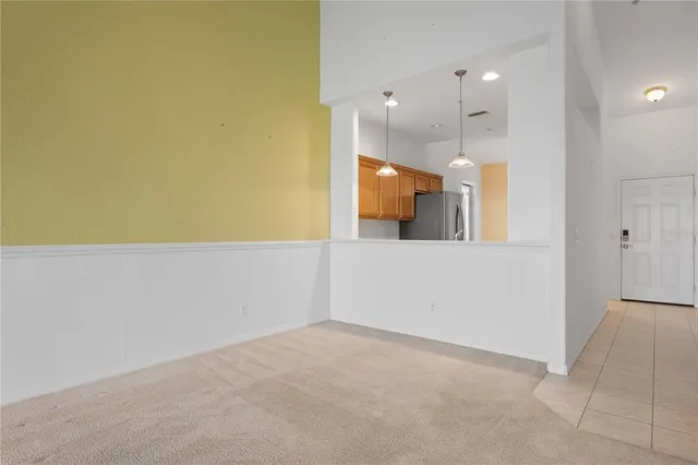 a view of a kitchen with a sink and cabinets