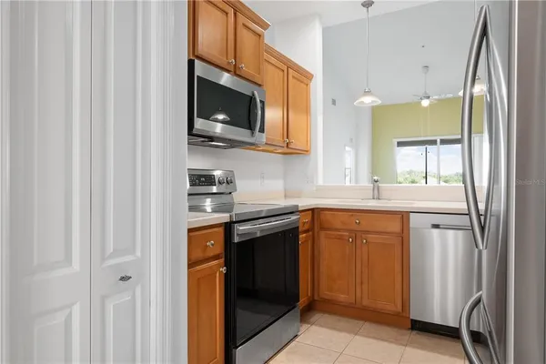 a kitchen with a sink and a refrigerator