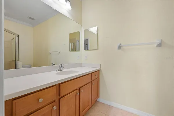 a bathroom with a shower a toilet and a sink
