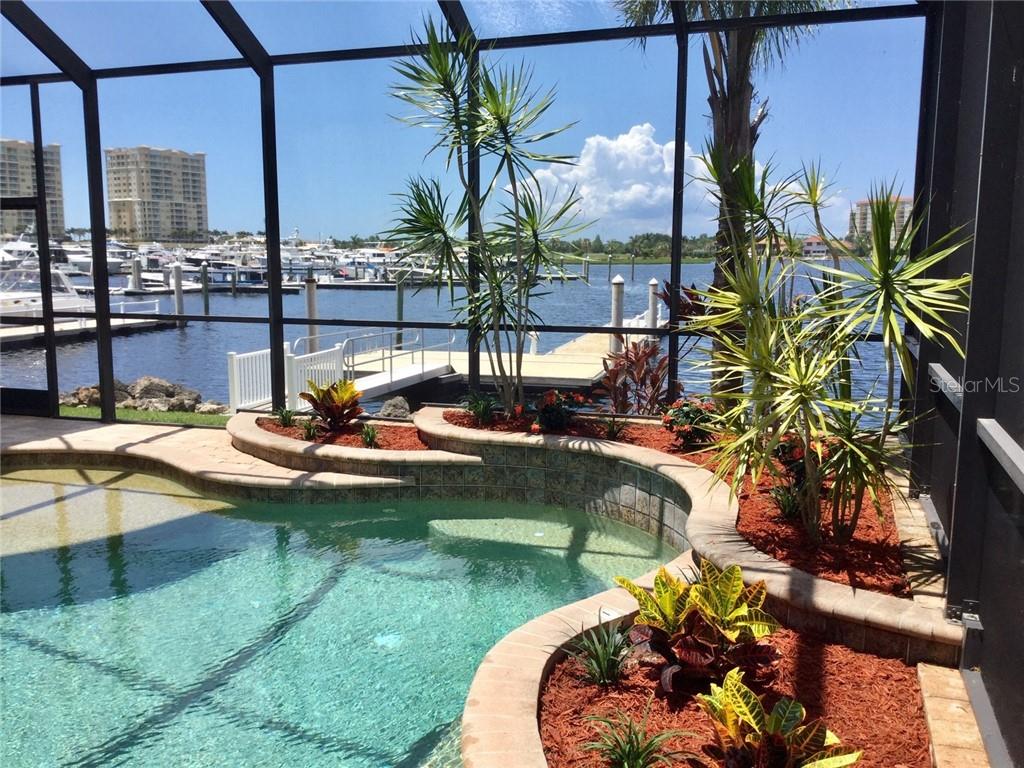 902 Riviera Dunes Way Palmetto, FL 34221 - Photo 1 of 1 Pleasant view inside the caged lanai and outside