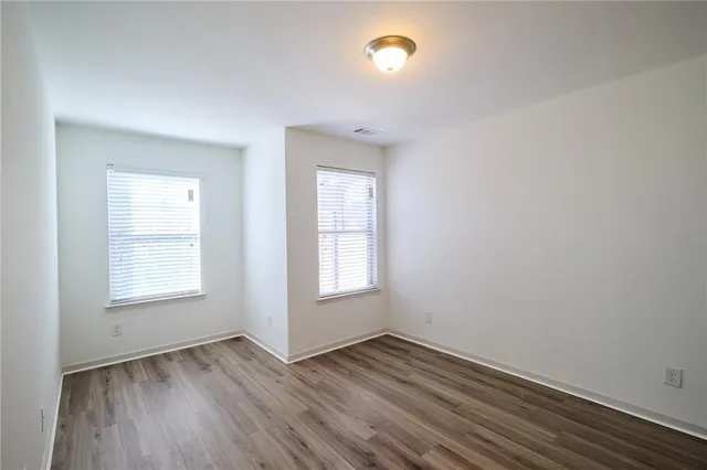 a view of room with wooden floor