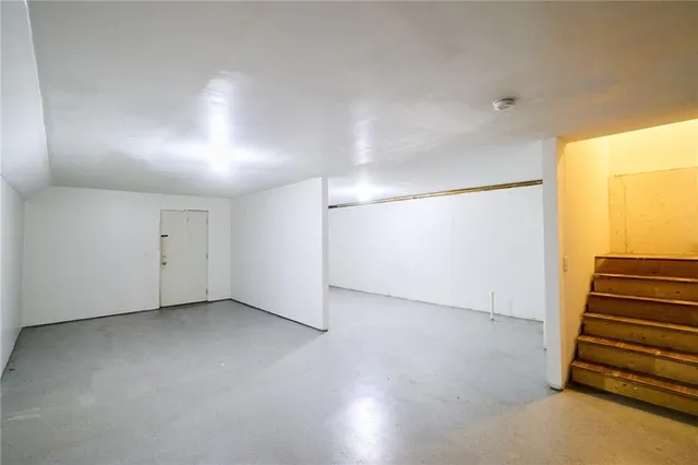 a bathroom with a shower and a window