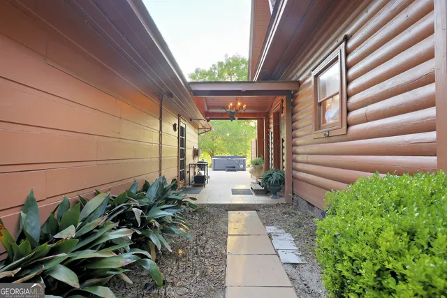 a living room with furniture fireplace and wooden floor