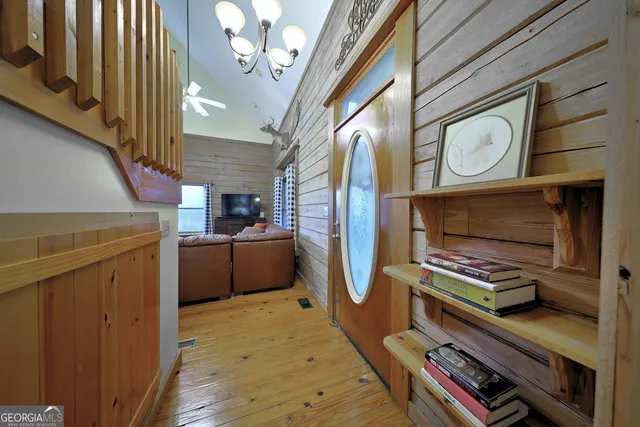 a living room with furniture and a ceiling fan