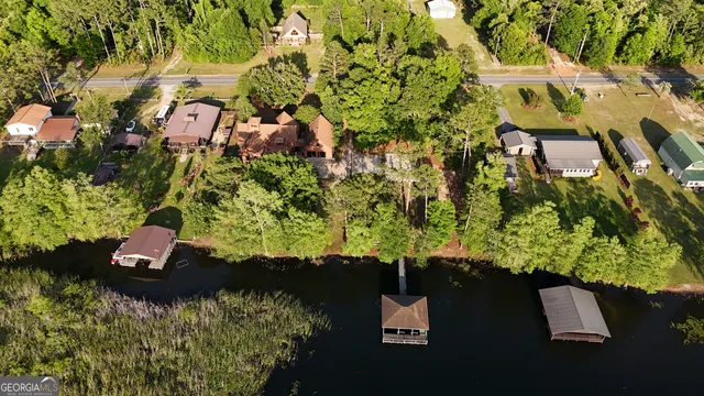 an aerial view of a house with a yard basket ball court