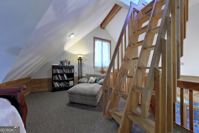 a view of a lake with houses in the background