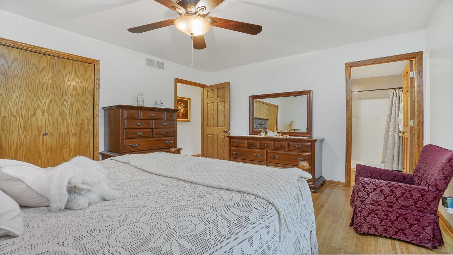 8317 Alan Court Rockford, IL 61108 - Photo 14 of 29 a bedroom with a bed and wooden floor