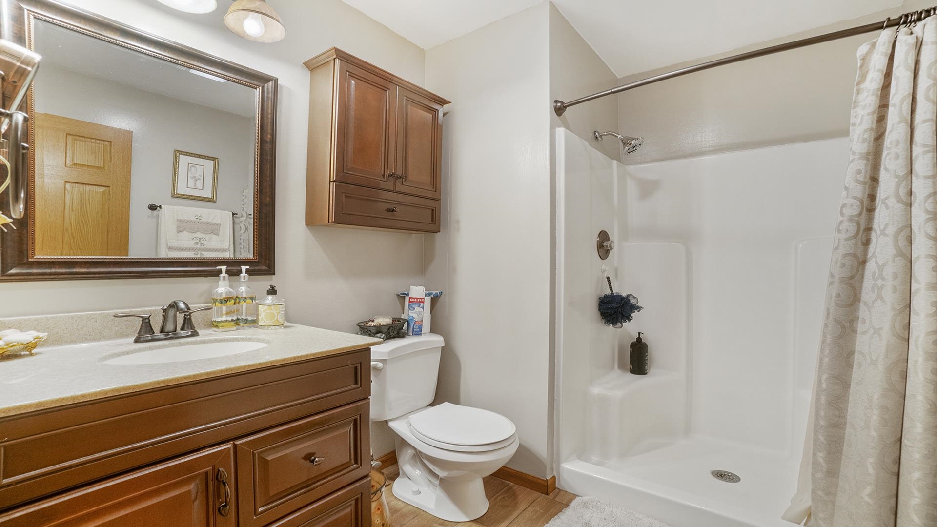 8317 Alan Court Rockford, IL 61108 - Photo 15 of 29 a bathroom with a sink toilet and shower