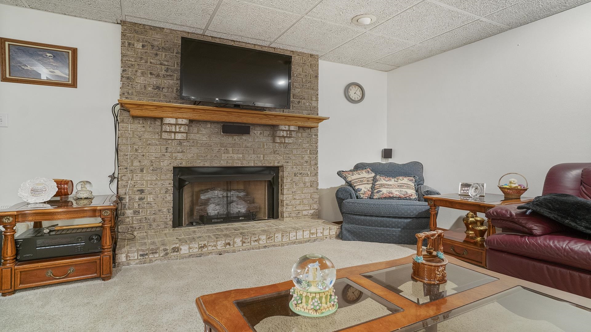 8317 Alan Court Rockford, IL 61108 - Photo 20 of 29 a living room with furniture and a fireplace