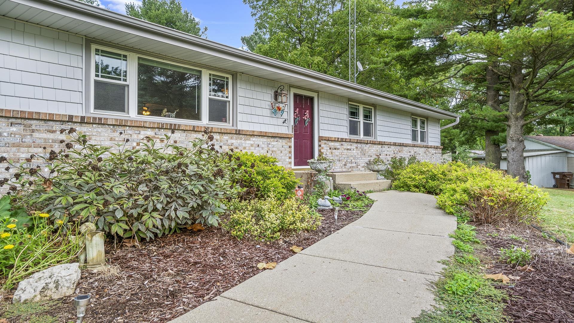 8317 Alan Court Rockford, IL 61108 - Photo 2 of 29 a house with a yard