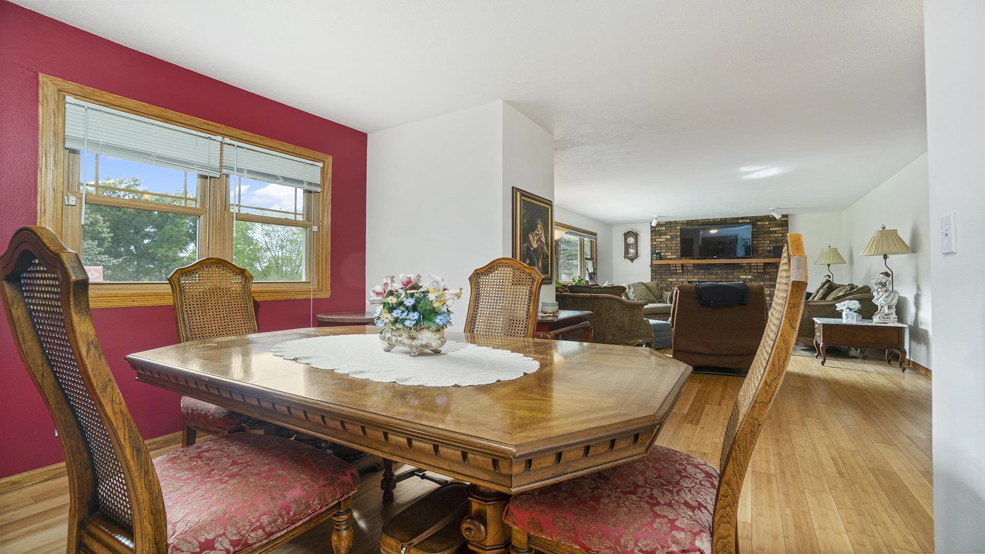 8317 Alan Court Rockford, IL 61108 - Photo 7 of 29 a view of a dining room with furniture window and wooden floor