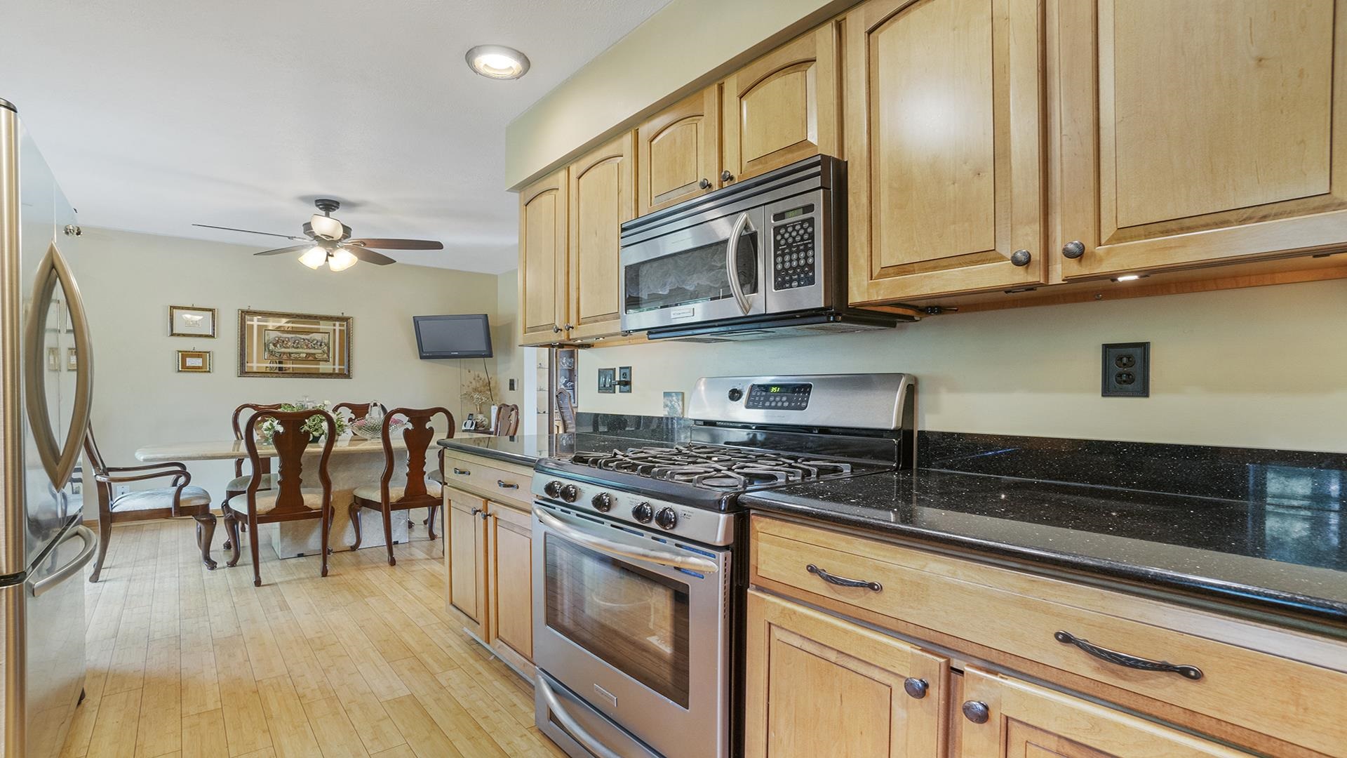8317 Alan Court Rockford, IL 61108 - Photo 9 of 29 a kitchen with stainless steel appliances granite countertop a stove a sink and a microwave