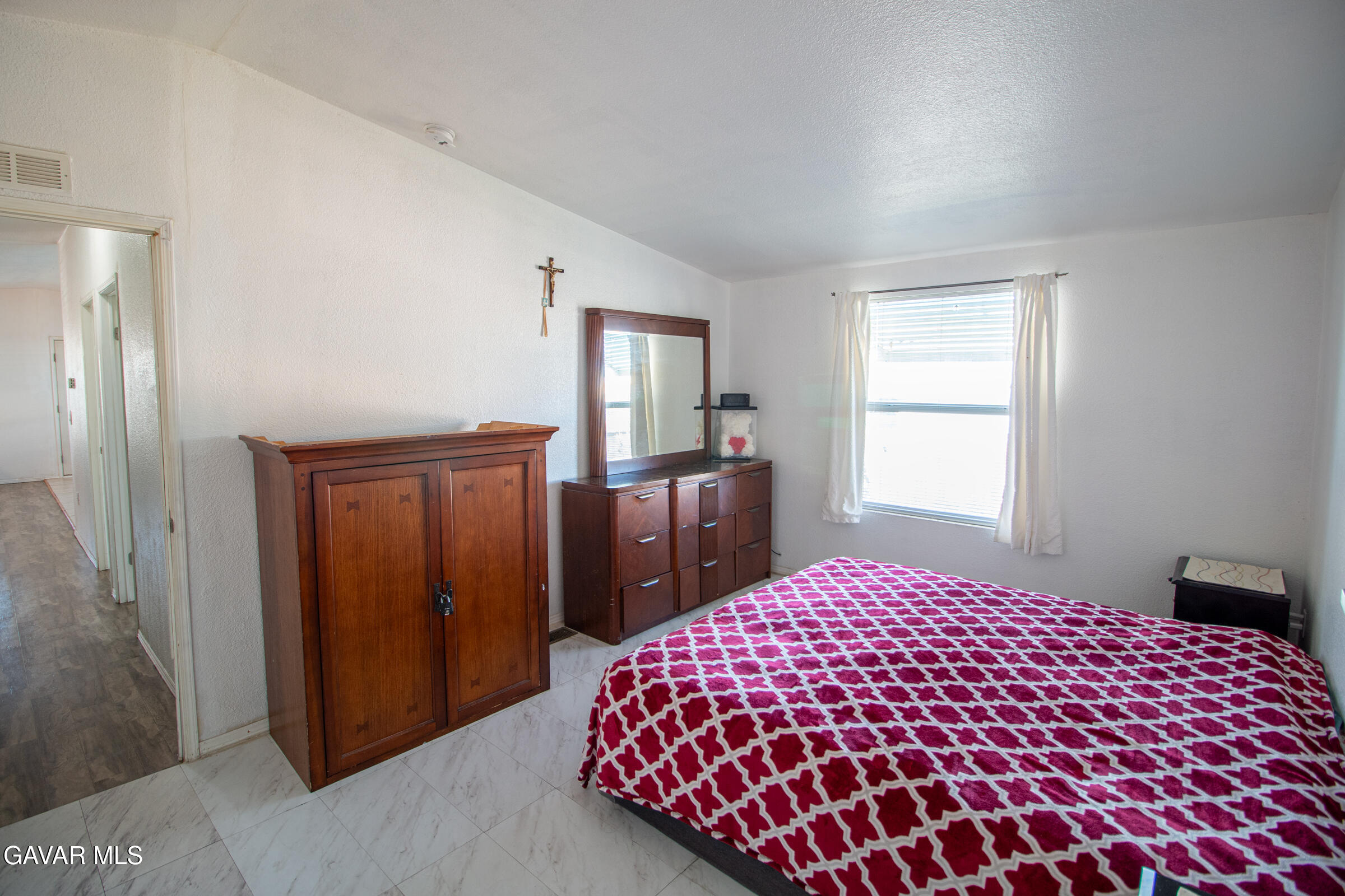 4444 Avenue R Palmdale, CA 93552 - Photo 11 of 17 a bedroom with a bed and a dresser