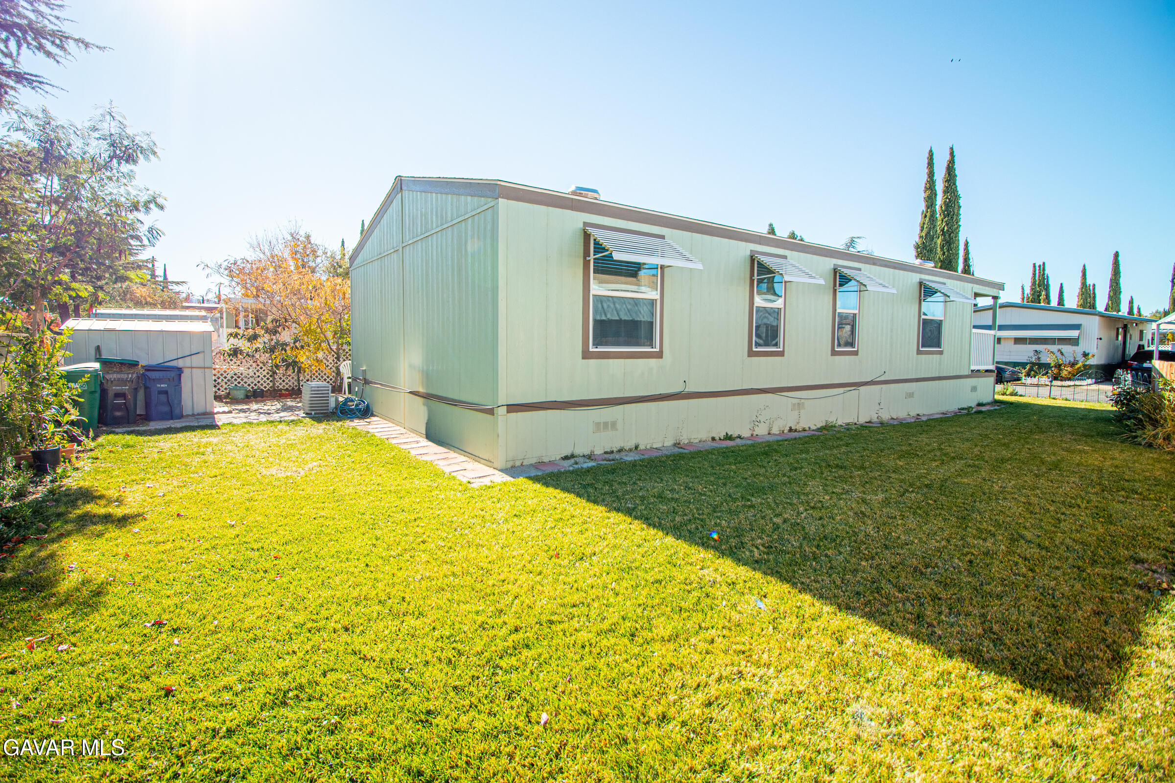 4444 Avenue R Palmdale, CA 93552 - Photo 5 of 17 a view of a house with a swimming pool