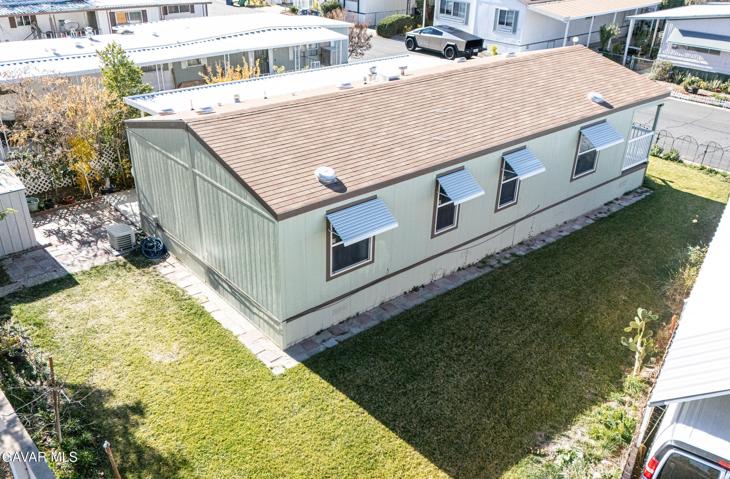 4444 Avenue R Palmdale, CA 93552 - Photo 6 of 17 a view of a swimming pool with a garden