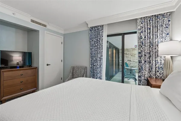 a bedroom with bed and a lamp
