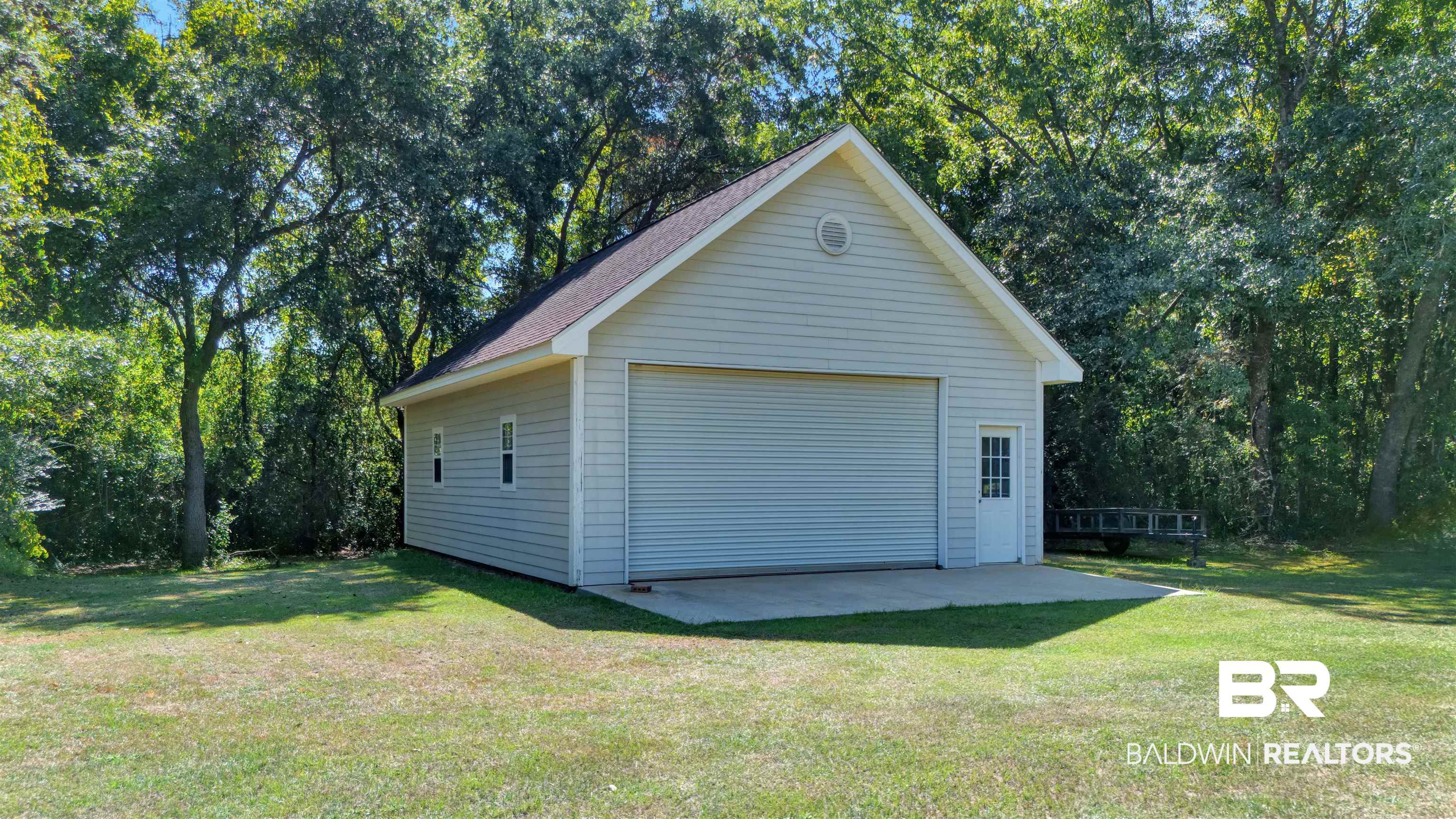 27688 Rigsby Road Daphne, AL 36526 - Photo 56 of 56 Garage featuring a yard