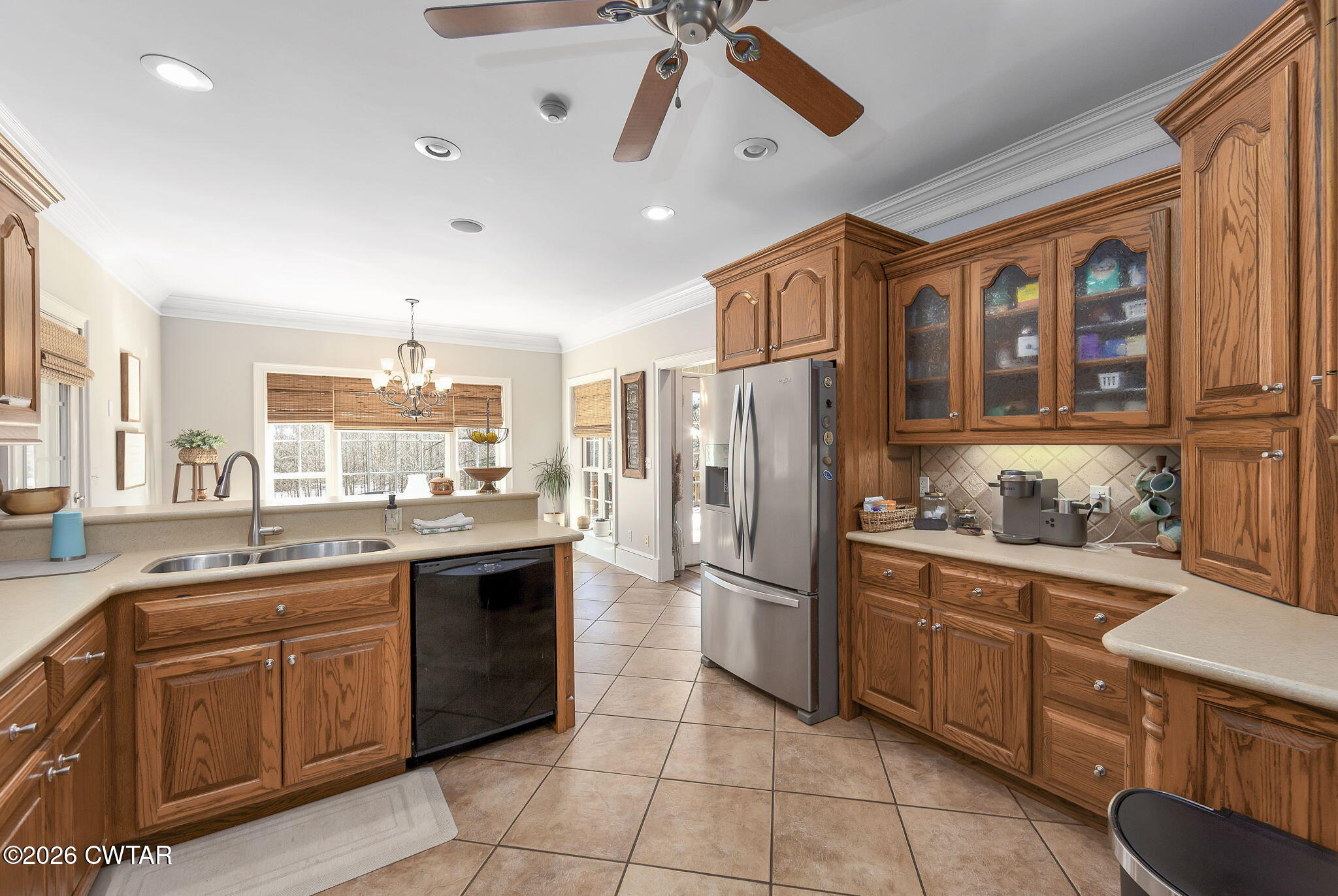 4320 Timberlake-Wildersville Road Lexington, TN 38351 - Photo 11 of 58 a kitchen with stainless steel appliances granite countertop a refrigerator and a sink
