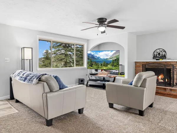 a living room with furniture and a large window